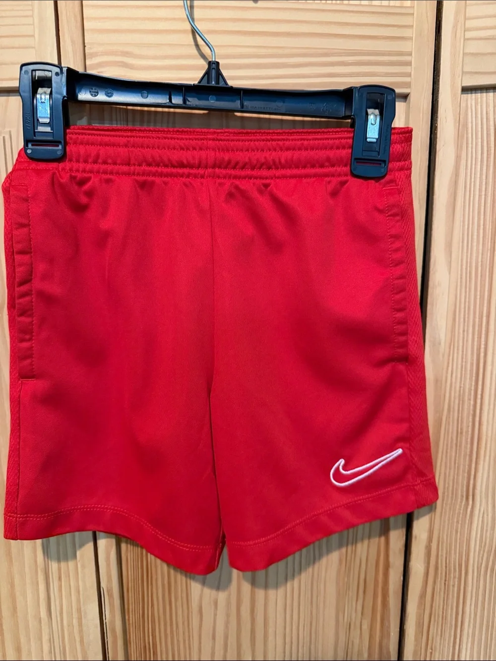 Nike Red Kids Athletic Shorts with White Swoosh